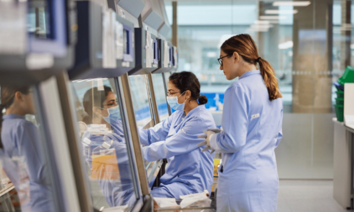 Two female researchers work in a laboratory at Autolus